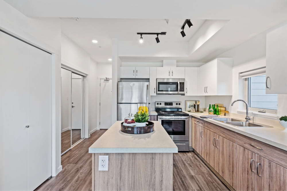 1 bedroom: kitchen, island, stainless steel appliances